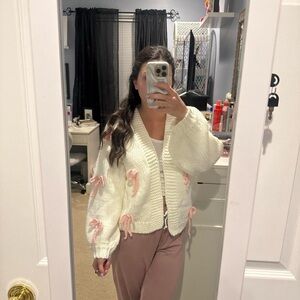Chunky Cream Knit Cardigan with Pink Bow Accents